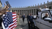 Pope Leo XIV waves as the popemobile passes by a crowd of American pilgrims gathered in St. Peter’s Square for the pope’s general audience on June 18, 2025, at the Vatican.